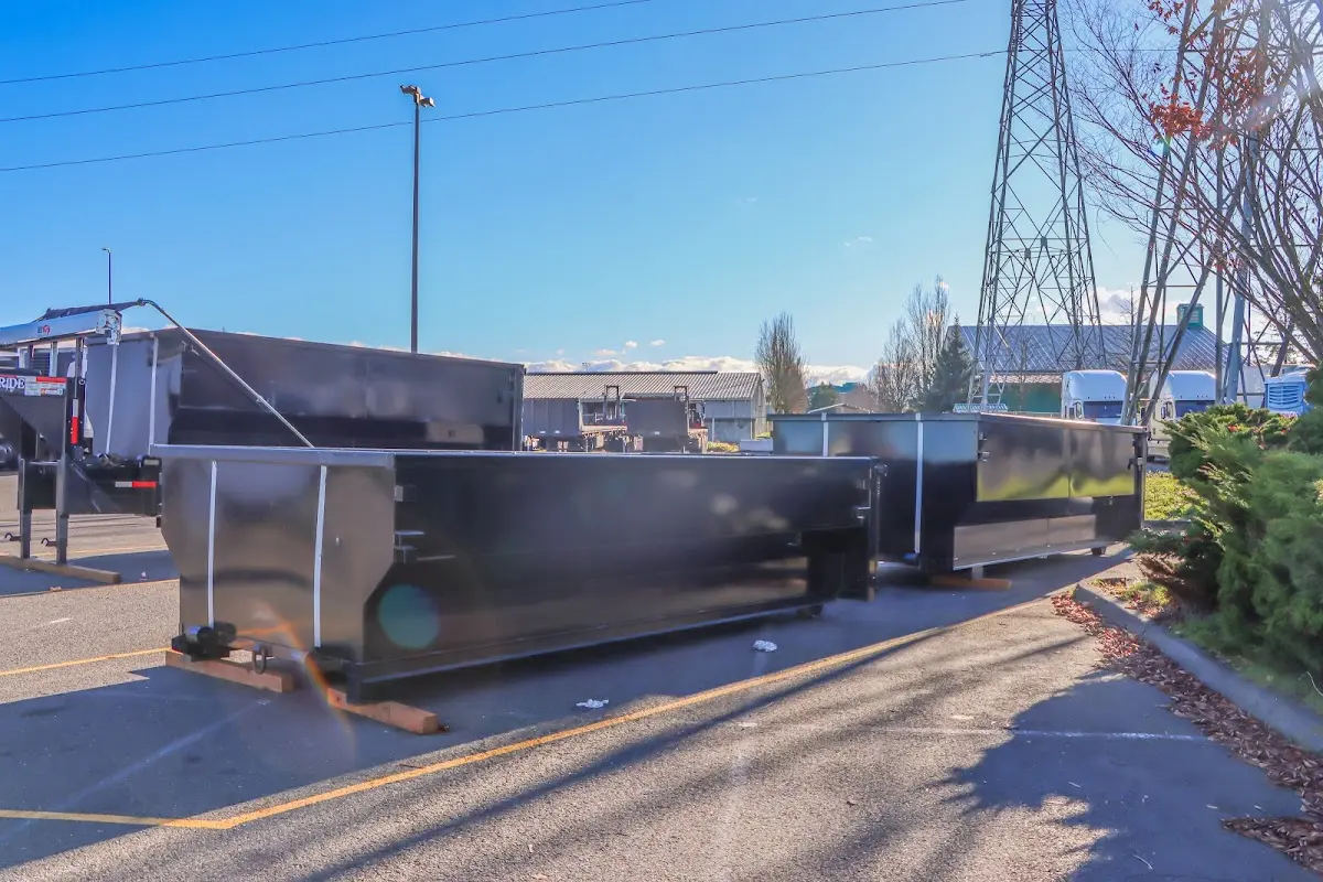 Roll-off dumpster ready for waste disposal at job site for 2 Yard Dumpster Rental in Randolph